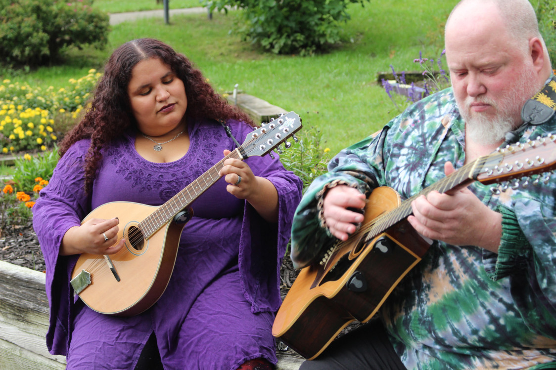 Lizzie Crowe and Eric Coleman of Iowa-based filk band Cheshire Moon often sing about topics like twisted fairy tales, libraries and Snow White. Photo courtesy of Amanda Jayne and Raeanne Dewey.