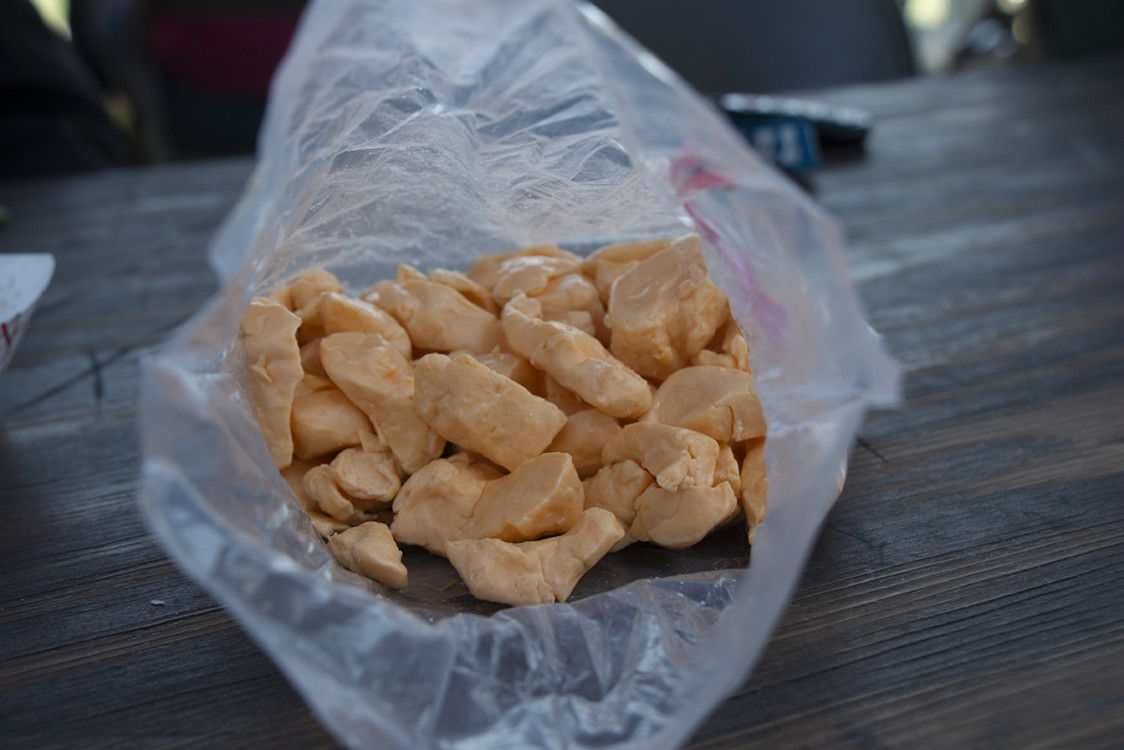 Fresh cheese curds in a plastic bag