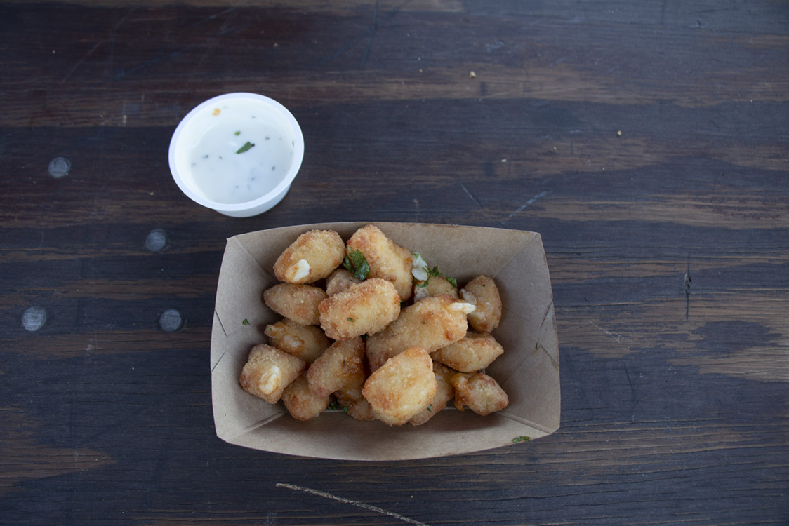 Truffled cheese curds in a boat container