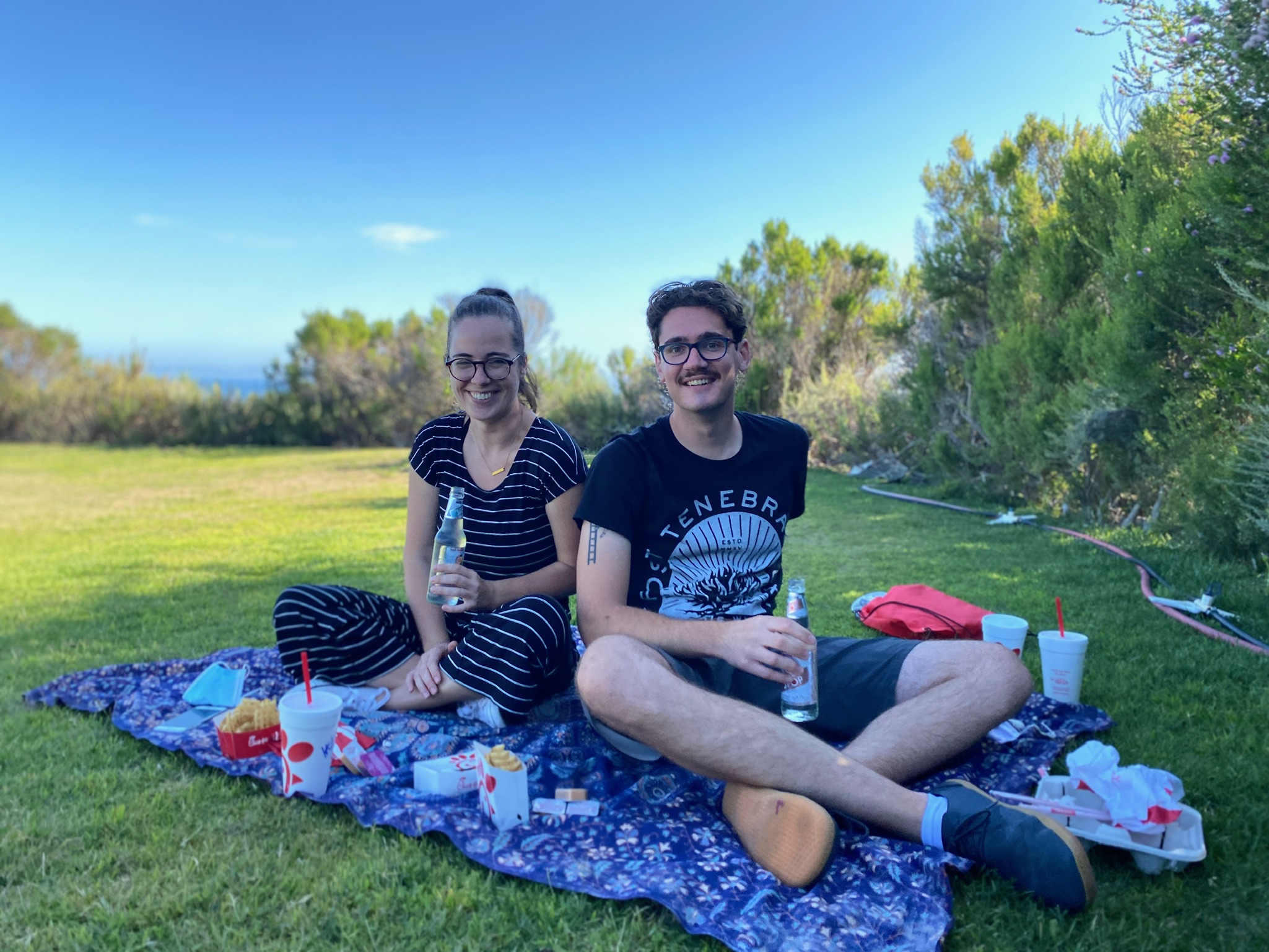 Annaliese and Jared at an outside picnic