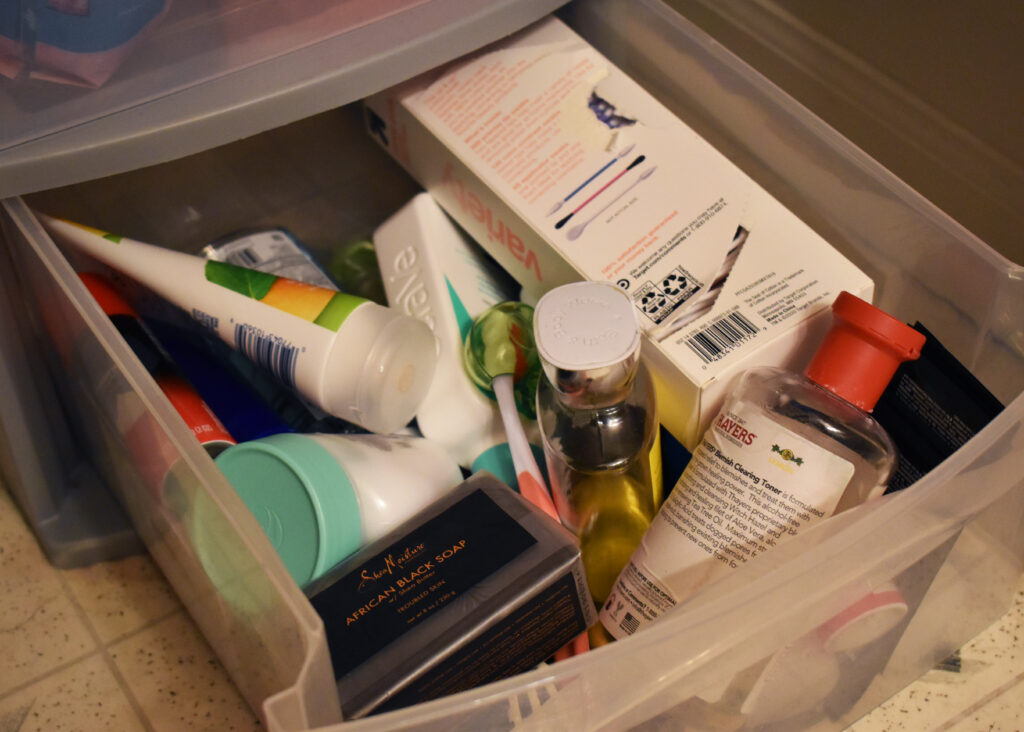 a messy drawer full of random items