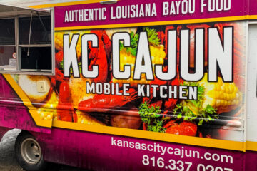 The KC Cajun food truck, featuring the business’ phone number (816-337-0207) and website (kansascitycajun.com).