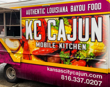 The KC Cajun food truck, featuring the business’ phone number (816-337-0207) and website (kansascitycajun.com).