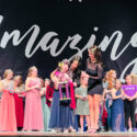 A contestant is crowned and given a trophy at Miss Iowa Amazing, February 2023.