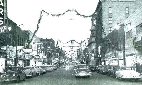  In this undated photo, cars drive down Central Avenue in Fort Dodge, surrounded by historic buildings. 

