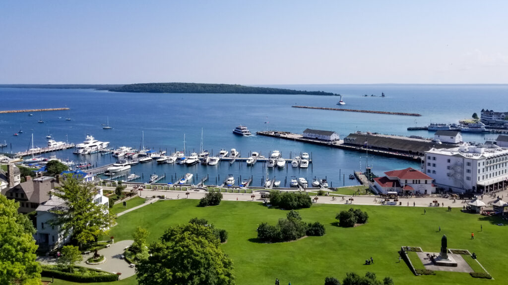 A bird’s-eye view of Lake Huron and several boats in the harbor from Fort Mackinac of Mackinac Island, Michigan.