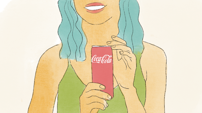 A graphic shows a person with blue hair from the mouth down. They are smiling and wearing a green shirt while holding a Coca-Cola can.