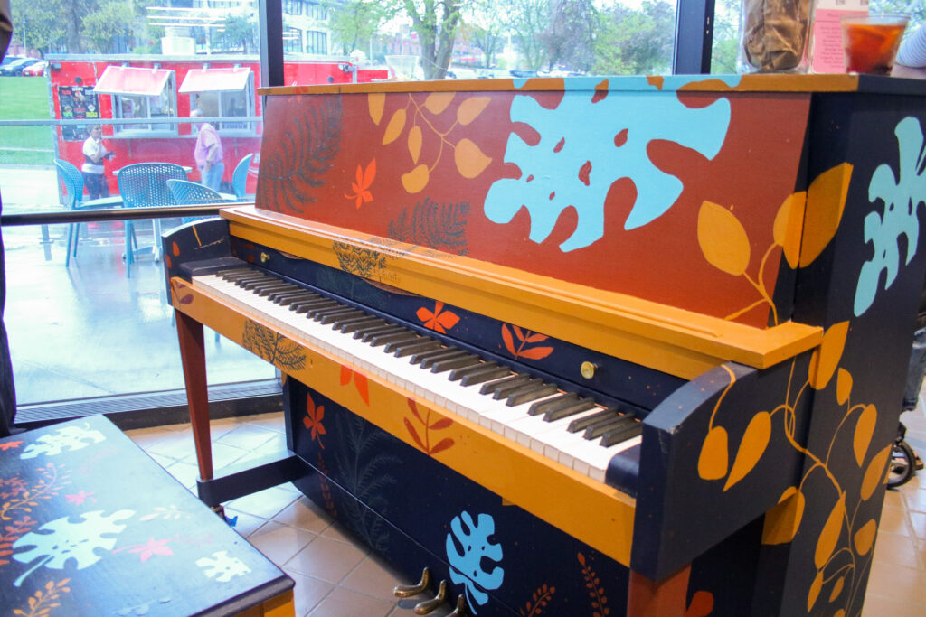 A photo of flower painted piano. 
